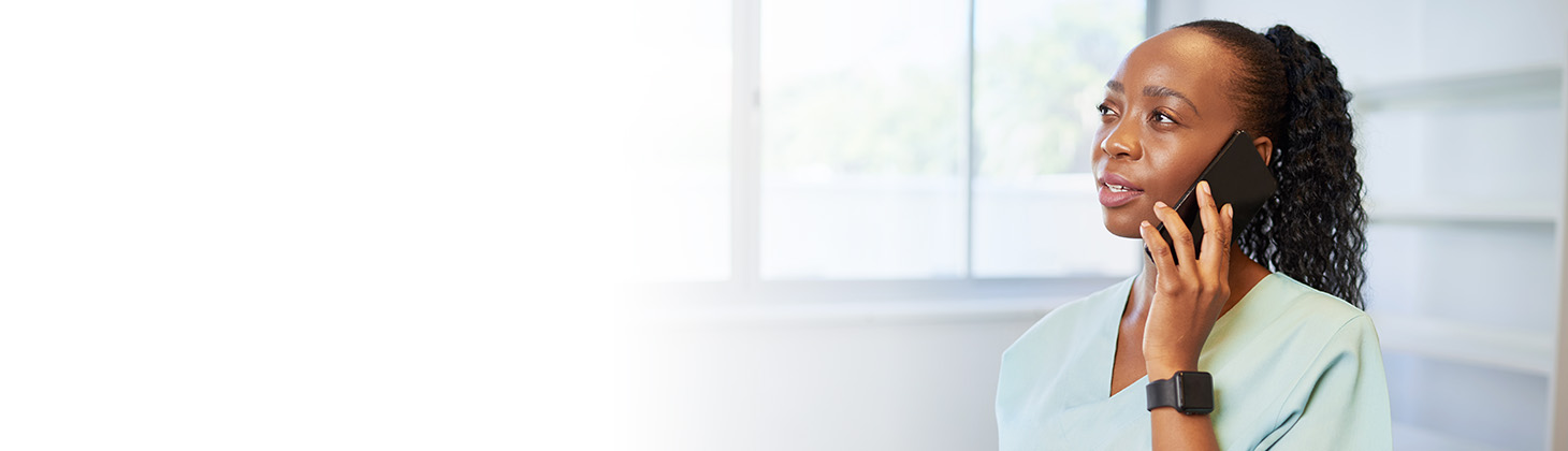 A dental office worker on the telephone.